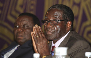 Zimbabwe's President Mugabe and Prime Minister Tsvangirai attend a joint meeting of senior members of their respective parties to discuss political violence, in Harare
