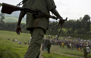 An FDLR soldier walks toward a distribution center near Lushubere Camp in Masisi in the DRC