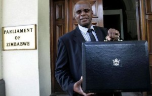 1-zimbabwe-s-acting-minister-of-finance-chinamasa-holds-up-briefcase-containing-government-budget-in-harare_432